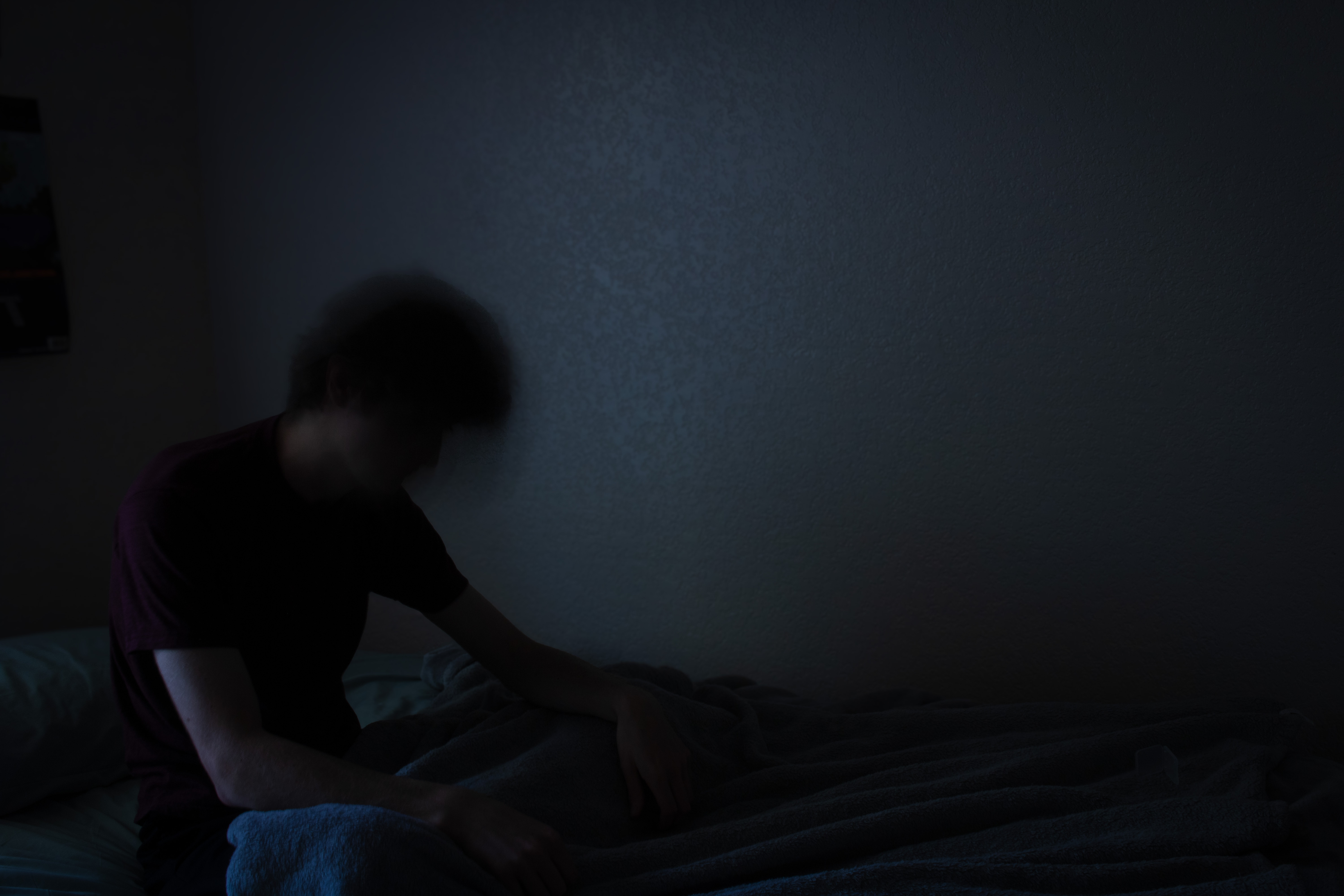 Figure in bed at night